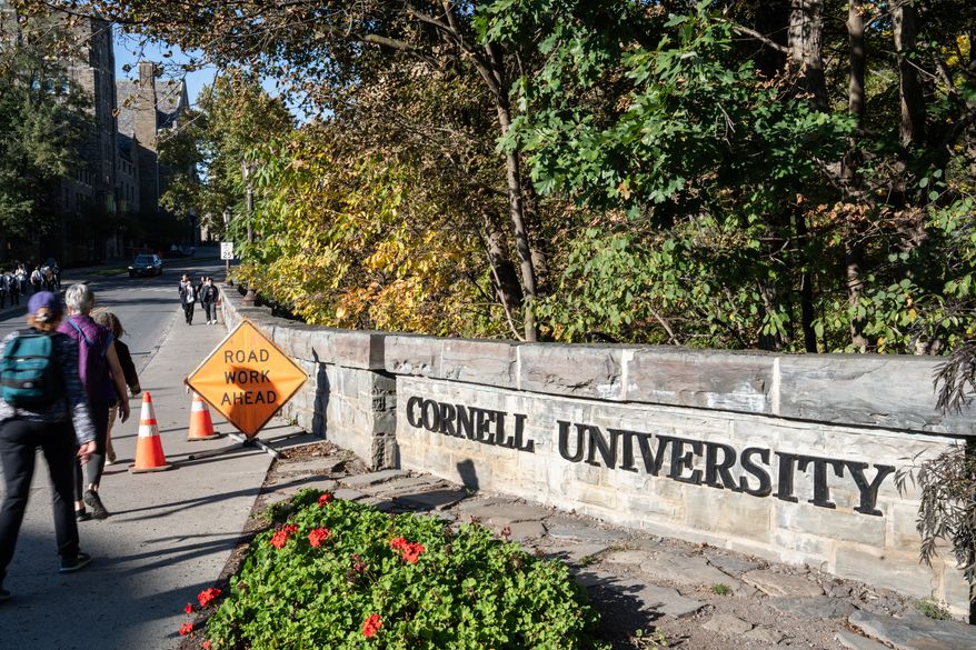Students walk through Cornell University's campus, Wednesday, Oct. 7, 2026, in Ithaca, N.Y. (AP Photo/Matt Burkhartt)