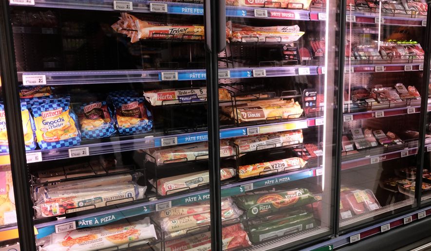 A view of a refrigerator two days after the cyberattack on several French supermarkets in Montreuil, France, Wednesday, Oct. 14, 2026. (AP Photo/Teresa Suarez)