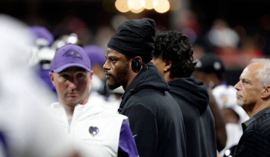 Injured Baltimore Ravens quarterback Lamar Jackson watches from the sideline during the first half of an NFL football game against the Atlanta Falcons, Sunday, Oct. 11, 2026, in Atlanta. (AP Photo/Erik S. Lesser)