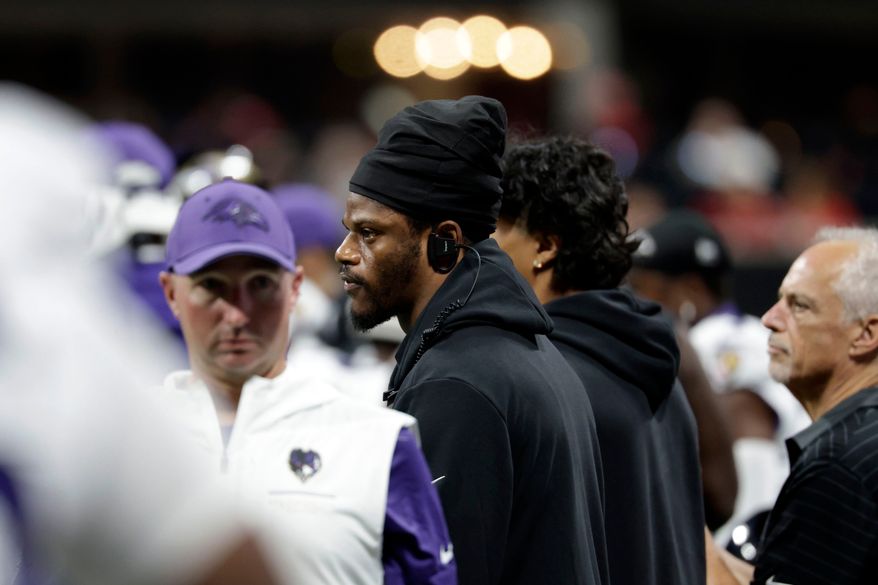 Injured Baltimore Ravens quarterback Lamar Jackson watches from the sideline during the first half of an NFL football game against the Atlanta Falcons, Sunday, Oct. 11, 2026, in Atlanta. (AP Photo/Erik S. Lesser)
