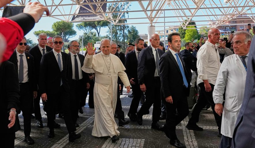 Pope Leo XIV arrives at the Agostino Gemelli Polyclinic in Rome, Tuesday, Oct. 13, 2026, where he's expected to be operated to remove a lung nodule. (AP Photo/Alessandra Tarantino)