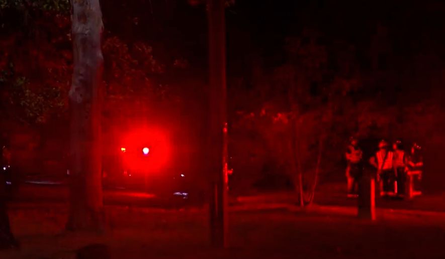 This image taken from WKOW video shows first responders at the scene of a fatal plane crash Tuesday, Oct. 13, 2026, in a wooded area near Mirror Lake State Park in the Town of Dellona, Wis. (WKOW via AP)