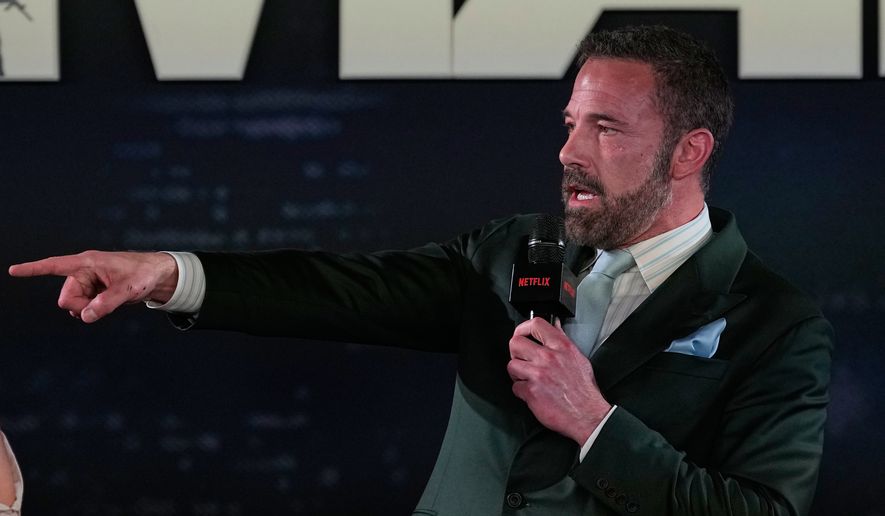 Ben Affleck points to the fans during a red carpet fan event promoting the film "Animals" in Mexico City, Sunday, Oct. 4, 2026. (AP Photo/Fernando Llano)