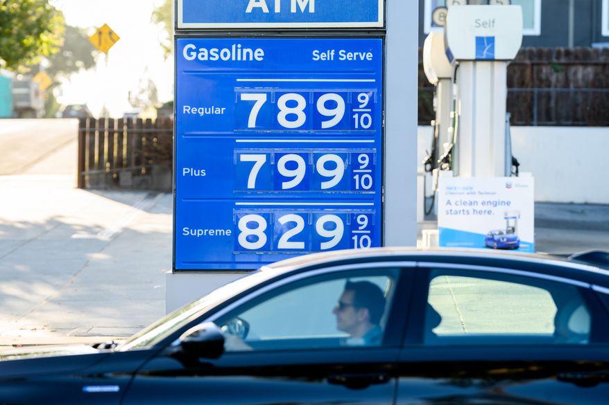 A driver passes a marquee displaying gas prices at a Menlo Park, Calif., Chevron station on Monday, Oct. 5, 2026. (AP Photo/Noah Berger)