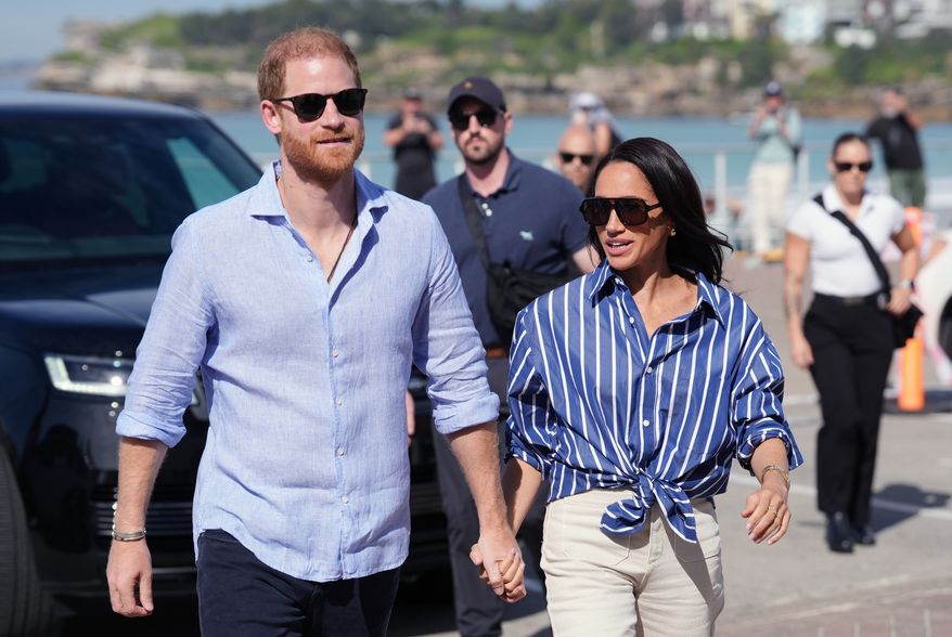 Prince Harry and Meghan, the Duke and Duchess of Sussex, arrive to meet volunteer first responders from Bondi Surf Bathers' Life Saving Club, during a visit to Bondi Beach, Australia, on April 17, 2026. (Jonathan Brady/Pool Photo via AP, File)