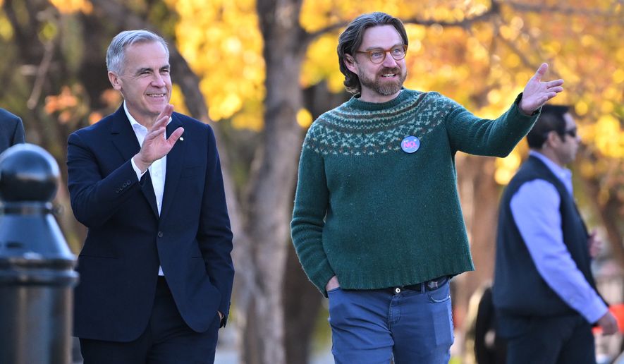 Prime Minister Mark Carney, left, arrives with Executive Director of Public Interest Alberta Brad Lafortune to meet volunteers at Bridgeland Riverside Community Association Park in Calgary, Alberta, on Thursday Oct. 15, 2026. (Mike Sturk/The Canadian Press via AP)