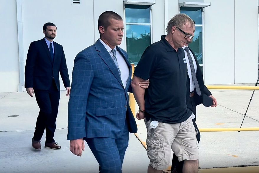 In this image taken from video released by the Orlando Police Department, Dale Smith Jr. is taken into custody in Orlando, Fla., on Wednesday, Oct. 14, 2026. (Orlando Police Department via AP)