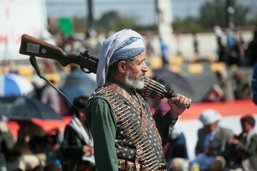 A supporter of Yemen's Houthi rebels carries his rifle during a rally in support of the group in Sanaa, Yemen, Friday, Oct. 9, 2026. (AP Photo/Osamah Abdulrahman)