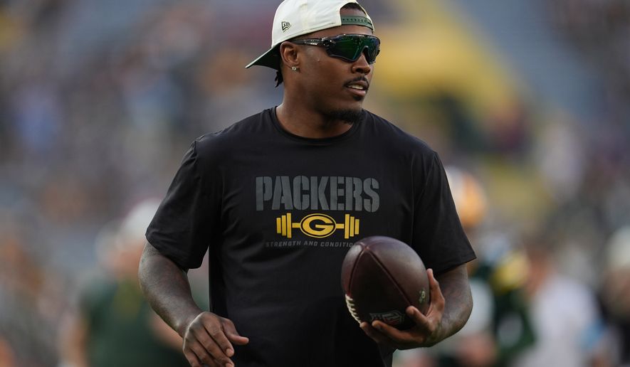 FILE - Green Bay Packers running back Josh Jacobs stands on the field before a preseason NFL football game against the Arizona Cardinals, Aug. 28, 2026, in Green Bay, Wis. (AP Photo/Abbie Parr, File)