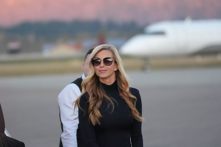 White House press secretary Katie Zacharia arrives with President Donald Trump at Glacier Park International Airport, Wednesday, Oct. 14, 2026, in Kalispell, Mont. (AP Photo/Alex Brandon)