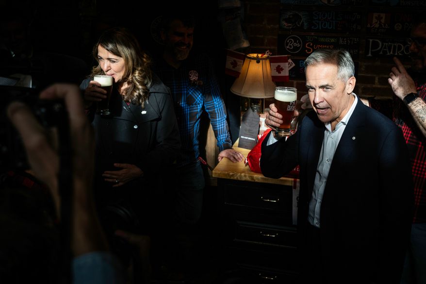 Prime Minister Mark Carney attends a national unity rally in Red Deer alongside Alberta Premier Danielle Smith on Friday, Oct. 16, 2026.. (John Ulan/The Canadian Press via AP)