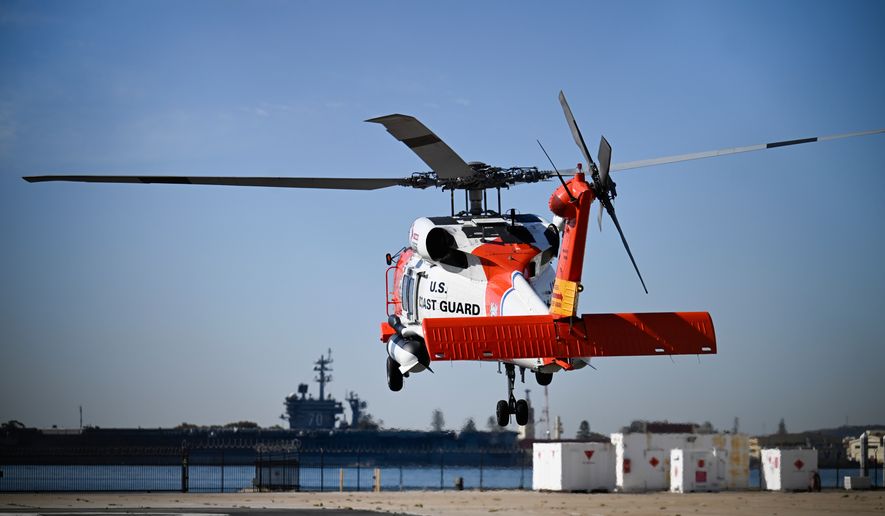 A U.S. Coast Guard helicopter lifts off at Coast Guard Station San Diego, Friday, Oct. 16, 2026, in San Diego. (AP Photo/Denis Poroy)