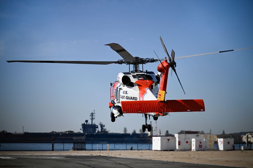 A U.S. Coast Guard helicopter lifts off at Coast Guard Station San Diego, Friday, Oct. 16, 2026, in San Diego. (AP Photo/Denis Poroy)