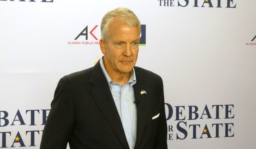 In this photo shot with a smart phone, Alaska Republican U.S. Sen. Dan Sullivan poses ahead of a debate with Democrat Mary Peltola in Alaska's Senate race, Thursday, Oct. 15, 2026, in Anchorage, Alaska. (AP Photo/Becky Bohrer)