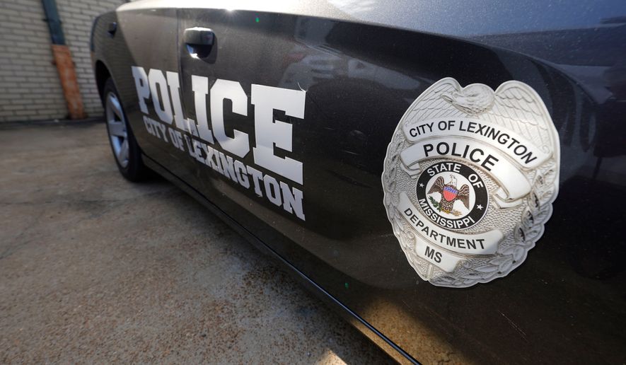 FILE - A Lexington, Miss., police cruiser is parked outside their facility near the town square, Monday, Aug. 15, 2022. The Lexington police department unconstitutionally jailed people for unpaid fines without first assessing whether they could afford to pay them, the U.S. Department of Justice said Thursday, Feb. 29, 2024. (AP Photo/Rogelio V. Solis, File)