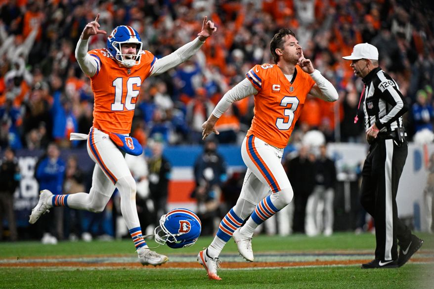 Denver Broncos place-kicker Wil Lutz (3) reacts with punter Jeremy Crawshaw (16) after making a field goal to win the game in overtime against the Seattle Seahawks in an NFL football game in Denver, Thursday, Oct. 15, 2026. (AP Photo/Geneva Heffernan)