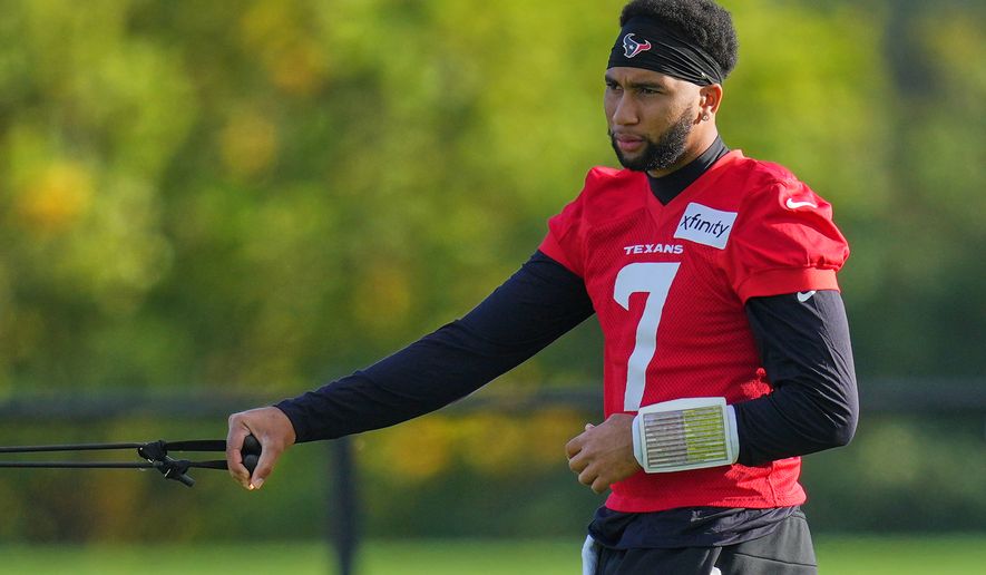 Houston Texans' quarterback C.J. Stroud (7) works out during an NFL football practice in Harrow, a London suburb, Friday, Oct. 16, 2026. (AP Photo/Kirsty Wigglesworth)