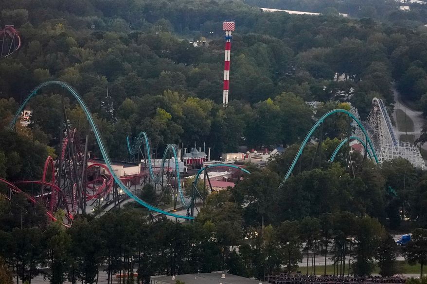 Attractions are seen at Six Flags Over Georgia, about 15 miles (24 kilometers) northwest of Atlanta, Thursday, Oct. 15, 2026, in Mableton. (AP Photo/Mike Stewart)