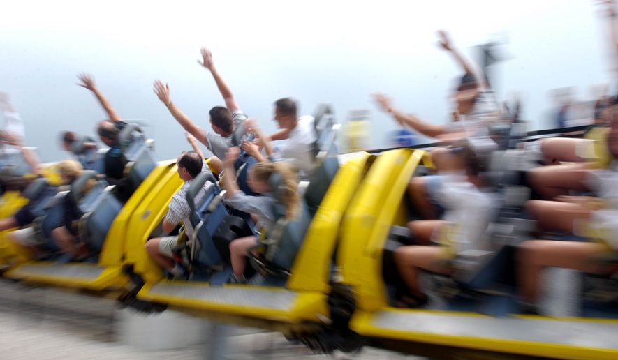Riders fly by on the Millennium Force, Tuesday, July 22, 2003, at Cedar Point Amusment Park in Sandusky, Ohio. Before the new Top Thrill Dragster appeared the Millennium Force claimed bragging rights as the world's tallest coaster. (AP Photo/J.D. Pooley)