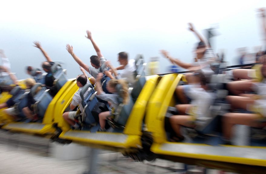Riders fly by on the Millennium Force, Tuesday, July 22, 2003, at Cedar Point Amusment Park in Sandusky, Ohio. Before the new Top Thrill Dragster appeared the Millennium Force claimed bragging rights as the world's tallest coaster. (AP Photo/J.D. Pooley)
