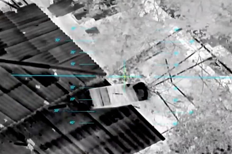 In this undated image from video provided by the Ukrainian 34th Separate Marine Brigade "Borysfen" on Oct. 4, 2026, a drone drops a parcel of supplies to civilians in the Russian-occupied city of Oleshky in the Kherson region of Ukraine. (Ukrainian 34th Separate Marine Brigade "Borysfen" via AP)