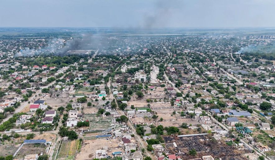 In this undated image from video provided by the Ukrainian 34th Separate Marine Brigade "Borysfen" on Sept. 22, 2026, smoke rises from a residential neighborhood in the Russian-occupied city of Oleshky in the Kherson region of Ukraine. (Ukrainian 34th Separate Marine Brigade "Borysfen" via AP)