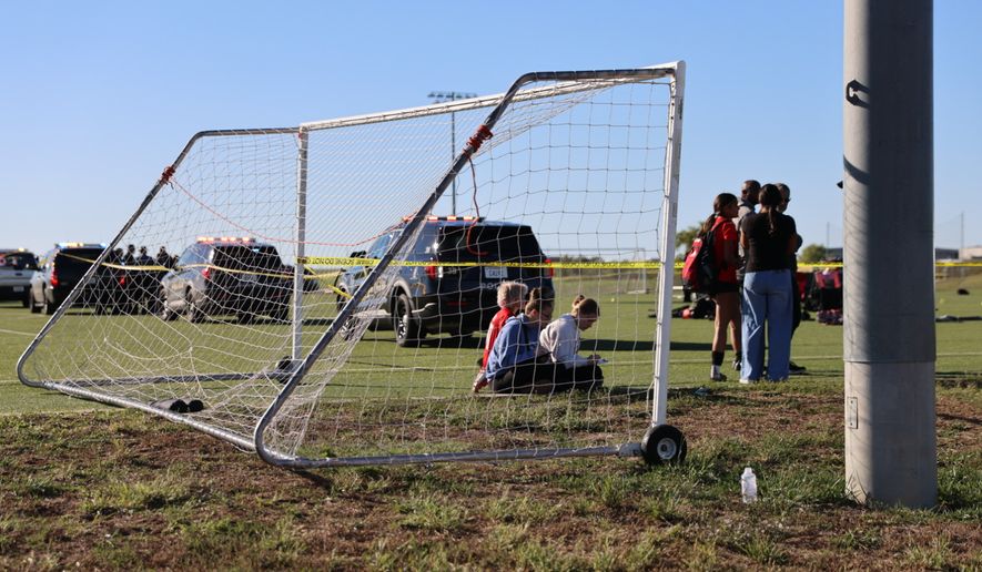 This image provided by KAKE shows police on the scene where a person drove a vehicle through a soccer field during a game in Wichita, Kansas, Saturday, Oct. 17, 2026. (Wyatt Glosson/KAKE via AP)