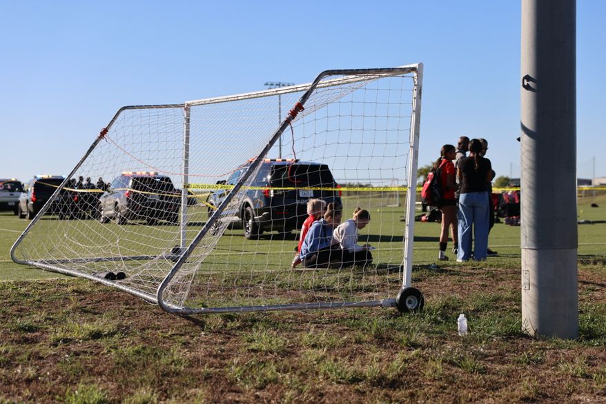 This image provided by KAKE shows police on the scene where a person drove a vehicle through a soccer field during a game in Wichita, Kansas, Saturday, Oct. 17, 2026. (Wyatt Glosson/KAKE via AP)
