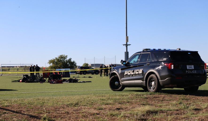 This image provided by KAKE shows police on the scene where a person drove a vehicle through a soccer field during a game in Wichita, Kansas, Saturday, Oct. 17, 2026. (Wyatt Glosson/KAKE via AP)