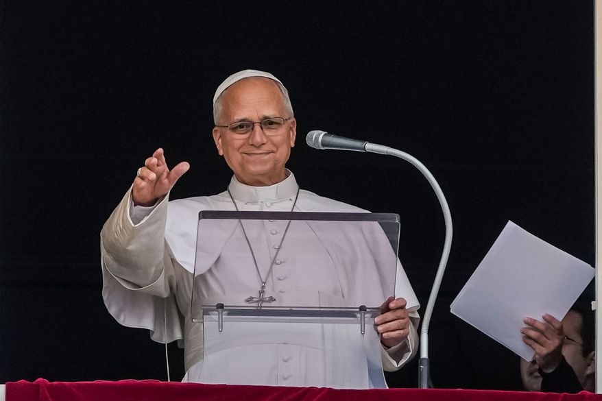 Pope Leo XIV appears at the window of his study in the Apostolic Palace overlooking St. Peter's Square at the Vatican for the traditional noon blessing after praying the Angelus, Sunday, Oct. 18, 2026, a day after he returned from the hospital, where he had lung cancer removed on Tuesday. (AP Photo/Alessandra Tarantino)
