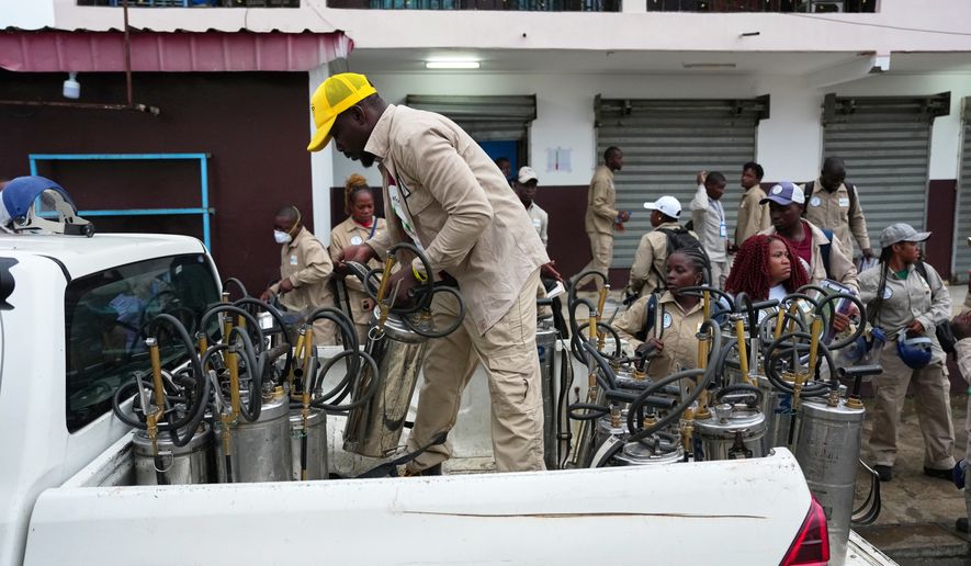 Health workers prepare to visit communities to spray insecticide and help prevent the spread of malaria in Malabo, Equatorial Guinea, April 24, 2026. (AP Photo/Misper Apawu)