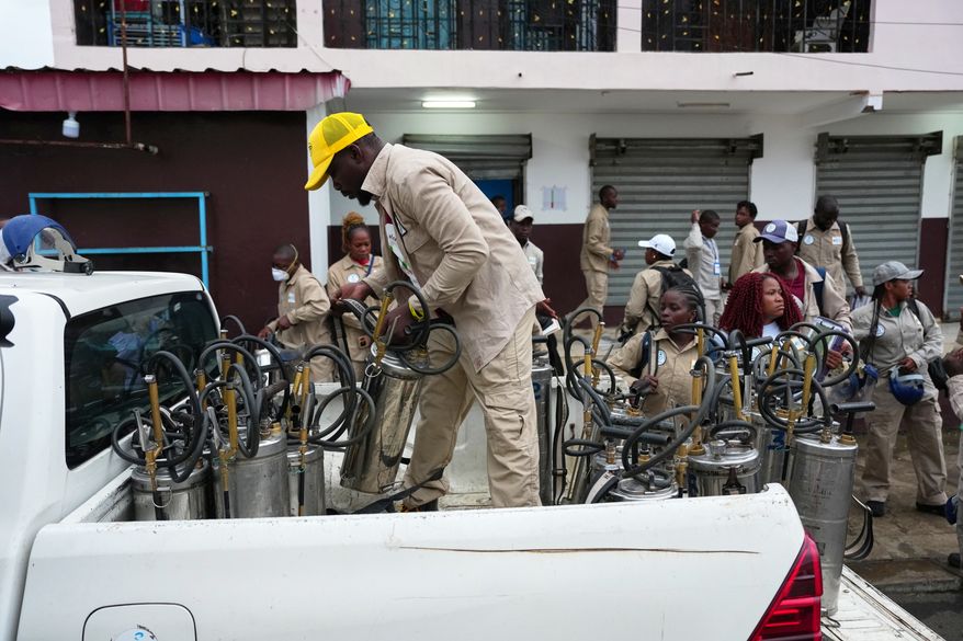 Health workers prepare to visit communities to spray insecticide and help prevent the spread of malaria in Malabo, Equatorial Guinea, April 24, 2026. (AP Photo/Misper Apawu)