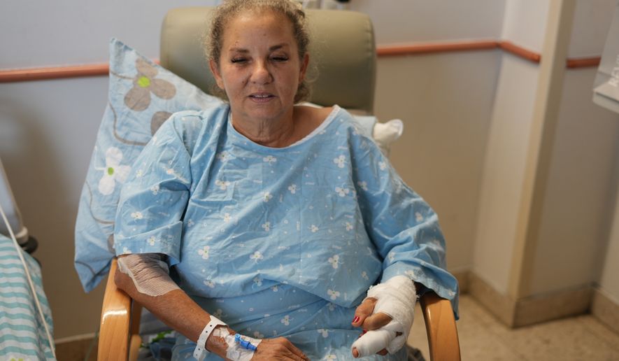 Washington Post photojournalist Heidi Levine receives treatment at Beilinson Hospital in Petah Tikva, Israel, Sunday, Oct. 18, 2026, after being injured in an attack by Israeli settlers while covering clashes that erupted during the Palestinian olive harvest in the West Bank village of Abu Falah on Friday. (AP Photo/Ariel Schalit)