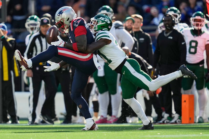 New England Patriots wide receiver A.J. Brown, left, can't make a catch as New York Jets cornerback Brandon Stephens, right, defends during the second half of an NFL football game in Foxborough, Mass., Sunday, Oct. 18, 2026. (AP Photo/Charles Krupa)