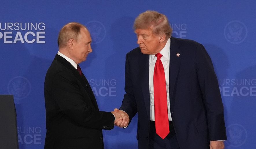 President Donald Trump, right, shakes the hand of Russia's President Vladimir Putin during a joint press conference at Joint Base Elmendorf-Richardson, Alaska, Aug. 15, 2025. (AP Photo/Jae C. Hong, File)