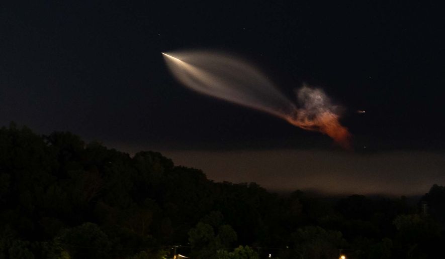 A SpaceX Falcon 9 rocket carrying supplies to the International Space Station is seen from Knoxville, Tenn., Tuesday, Oct. 13, 2026. (AP Photo/Camden Hall)