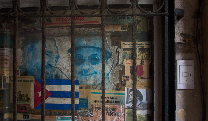Photos of former Presidents Raúl Castro, right, and his late brother Fidel Castro cover a front door in Havana, Monday, Oct. 19, 2026. (AP Photo/Ramon Espinosa)