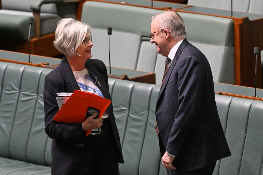 Australian Prime Minister Anthony Albanese speaks to Indepedent member of parliament, Helen Haines, in the House of Representatives at Parliament House in Canberra, Australia, Tuesday, Aug. 18, 2026. (Lukas Coch/AAP Image via AP )