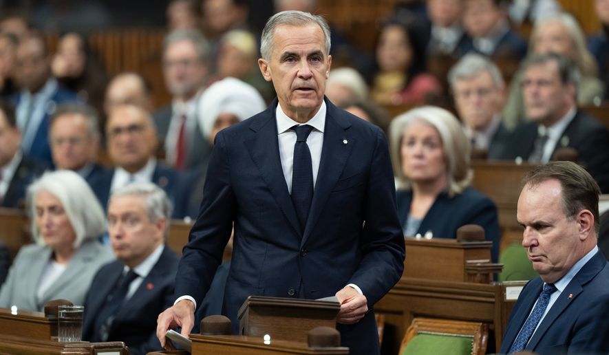 Canadian Prime Minister Mark Carney speaks about the incident at CFB Wainwright as he rises in the House of Commons in Ottawa, Monday, Oct. 19, 2026. (Adrian Wyld/The Canadian Press via AP)