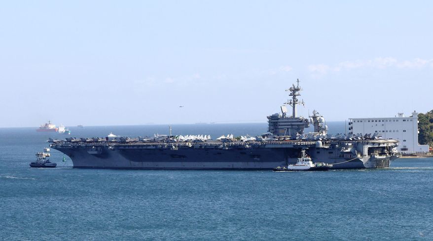 The U.S. aircraft carrier USS Theodore Roosevelt is seen leaving the Navy port of Yokosuka, near Tokyo, Monday, Oct. 19, 2026, to participate in the Keen Sword 27 exercise at an undisclosed location. (Kohei Tamai/Kyodo News via AP)