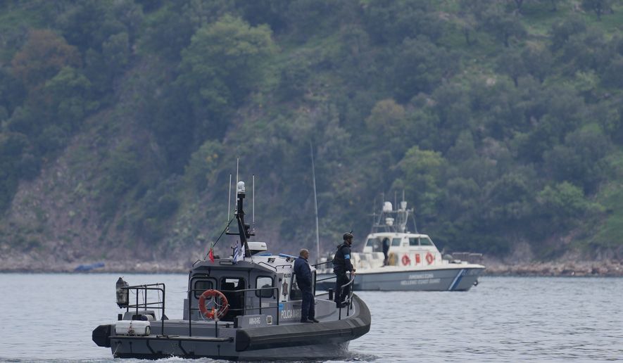 FILE - Frontex, foreground, and Greek coast guard vessels take part in a search and rescue operation, after the capsizing of a boat carrying migrants, off the coast on the northeastern Aegean Sea island of Lesbos, Greece, on April 3, 2025. (AP Photo/Panagiotis Balaskas, File)