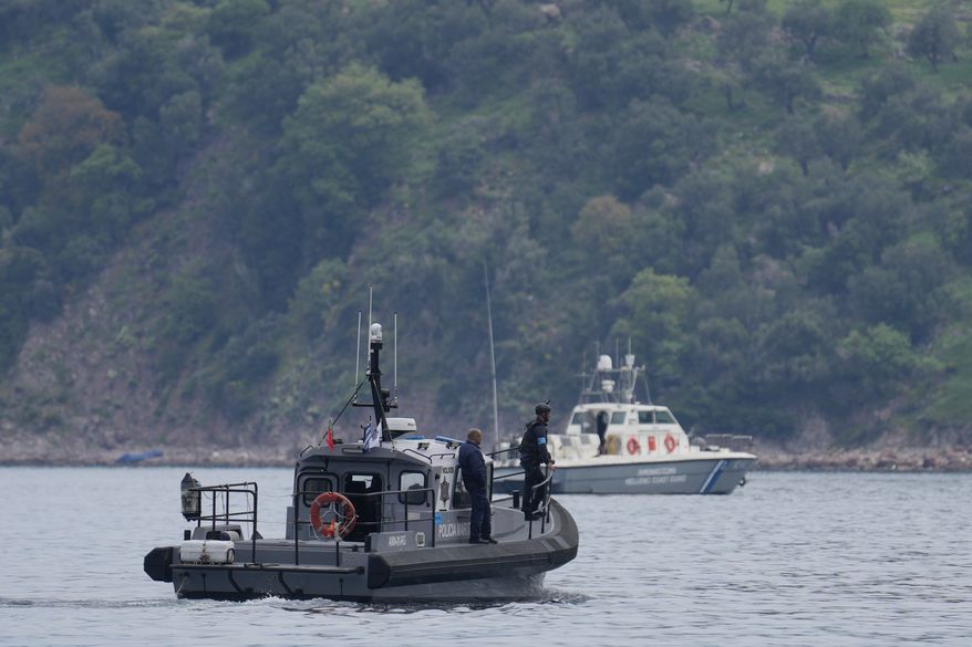 FILE - Frontex, foreground, and Greek coast guard vessels take part in a search and rescue operation, after the capsizing of a boat carrying migrants, off the coast on the northeastern Aegean Sea island of Lesbos, Greece, on April 3, 2025. (AP Photo/Panagiotis Balaskas, File)