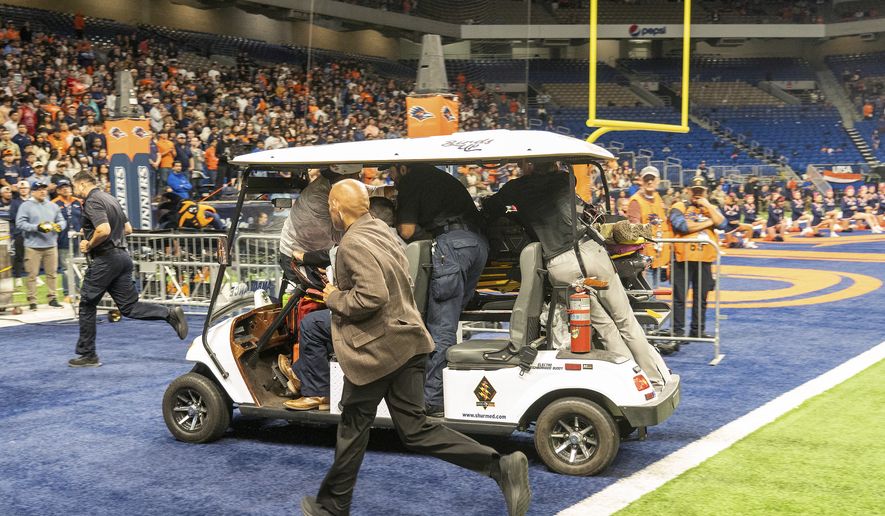 Emergency responders react to an accident before UTSA’s annual Salute to Armed Forces and Veterans football game at the Alamodome, Saturday, Oct. 17, 2026 in San Antonio, Texas. (Cody Duty/The San Antonio Express-News via AP)