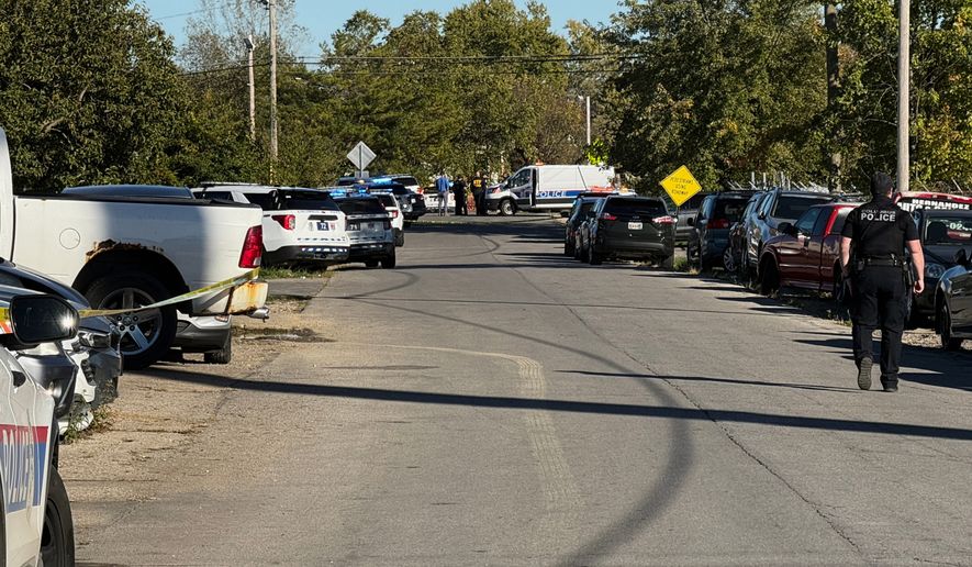 Law enforcement respond to the scene of a shooting Monday, Oct. 19, 2026, in Columbus, Ohio. (AP Photo/Patrick Aftoora-Orsagos)