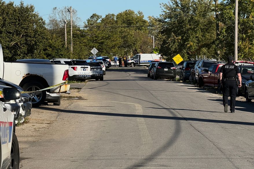 Law enforcement respond to the scene of a shooting Monday, Oct. 19, 2026, in Columbus, Ohio. (AP Photo/Patrick Aftoora-Orsagos)