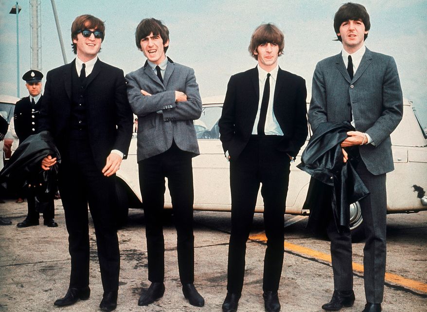 FILE - The Beatles, from left, John Lennon, George Harrison, Ringo Starr and Paul McCartney, arrive in Liverpool, England, on July 10, 1964, for the premiere of their movie "A Hard Day's Night." (AP Photo, File)