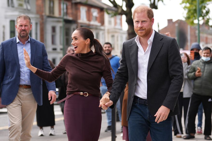 Britain's Prince Harry and Meghan, Duke and Duchess of Sussex visit the Himmah Hub in Nottingham, England, Thursday, Oct. 15, 2026. (Annabel Lee-Ellis/Pool Photo via AP)