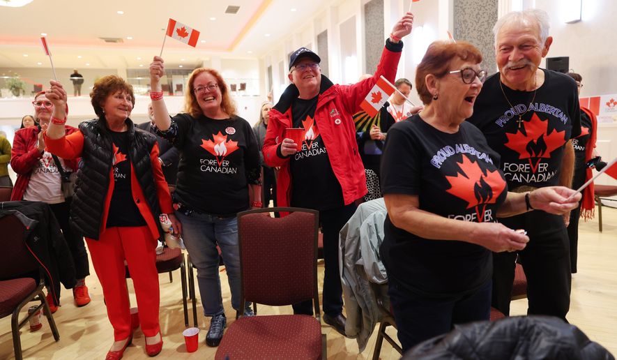 Supporters wait for results at the pro-Canada watch party in Edmonton, Alberta Monday, Oct. 19, 2026. (James Maclennan/The Canadian Press via AP)