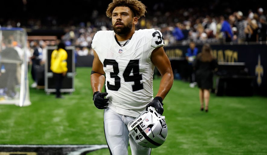 FILE - Las Vegas Raiders fullback Connor Heyward warms up before an NFL football game against the New Orleans Saints in New Orleans, Sept. 27, 2026. (AP Photo/Tyler Kaufman, File)