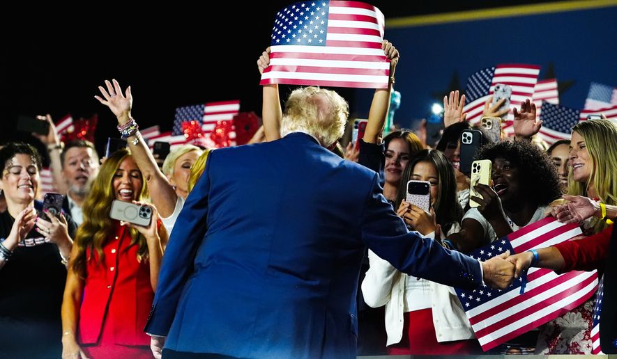 FILE - President Donald Trump greets supporters as he arrives to speak at the Republican convention, Sept. 10, 2026, in Dallas. (AP Photo/Julia Demaree Nikhinson, File)